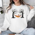 Skeleton Reading Book In Hammock Halloween Reader Unisex Sweatshirt