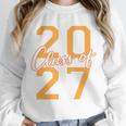 Class Of 2027 Graduation Varsity Orange On The Back Premium Tri-Blend Unisex Sweatshirt