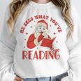 He Sees What You'Ve Been Reading Santa Book Unisex Sweatshirt