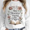 She Blooms Among The Pages Women Mom Wife Floral Book Lover Unisex Sweatshirt She Blooms Among The Pages Women Mom Wife Floral Book Lover Unisex Sweatshirt