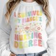 i Survived My Fiance's Nursing Degree Graduation Groovy Premium Unisex Sweatshirt