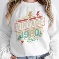 Vintage 1980 Retro Badge Decade Nostalgia Graphic Emblem Premium Tri-Blend Unisex Sweatshirt