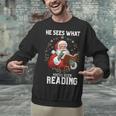 He Sees What You'Ve Been Reading Santa Book Lover Unisex Sweatshirt