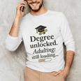 Graduation 2025 Degree Unlocked Adulting Still Loading Unisex Long Sleeve T-Shirt