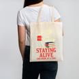 Staying Alive One Book At A Time Skeleton Reading Librarian Canvas Tote Bag Staying Alive One Book At A Time Skeleton Reading Librarian Canvas Tote Bag
