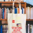 Staying Alive One Book At A Time Skeleton Reading Librarian Canvas Tote Bag Staying Alive One Book At A Time Skeleton Reading Librarian Canvas Tote Bag