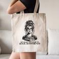 Book Lover Bent Over a Book Canvas Tote Bag
