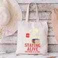 Staying Alive One Book At A Time Skeleton Reading Librarian Canvas Tote Bag Staying Alive One Book At A Time Skeleton Reading Librarian Canvas Tote Bag