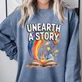 Unearth A Story Rainbow Treasure Book Comfort Colors Sweatshirt Denim Unearth A Story Rainbow Treasure Book Comfort Colors Sweatshirt Denim
