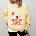 Staying Alive One Book At A Time Skeleton Reading Librarian Comfort Colors Sweatshirt Blue Spruce