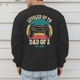I Leveled Up To Dad Of 2 2026 Promoted To Dad Of Two Kids Men's Sweatshirt Back Print