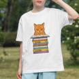 Cute Orange Tabby Cat Reading On Pile Of Books Graphic Youth
