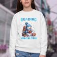 Reading Is Snow Much Fun Christmas Xmas Book Reading Youth Crewneck Sweatshirt