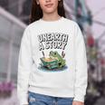 Unearth a Story Frog Reading a Book Summer 2026 Premium Tri-Blend Youth Crewneck Sweatshirt