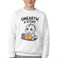 Unearth a Story Cute Dinosaur Summer Reading 2026 Dino Book Youth Crewneck Sweatshirt Unearth a Story Cute Dinosaur Summer Reading 2026 Dino Book Youth Crewneck Sweatshirt