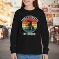 Women's Easily Distracted By Books Youth Long Sleeve Tee Women's Easily Distracted By Books Youth Long Sleeve Tee