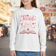 Read Your Heart Out Teacher Valentines Day Reading Book Love Premium Tri-Blend Youth Long Sleeve Tee Read Your Heart Out Teacher Valentines Day Reading Book Love Premium Tri-Blend Youth Long Sleeve Tee