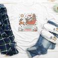 Book Lovers Winter Sleighing Through Stories Tee Premium Tri-Blend Youth Long Sleeve Tee