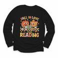 Fall In Love With Reading Autumn Pumpkin Teacher Book Lover Youth Long Sleeve Tee